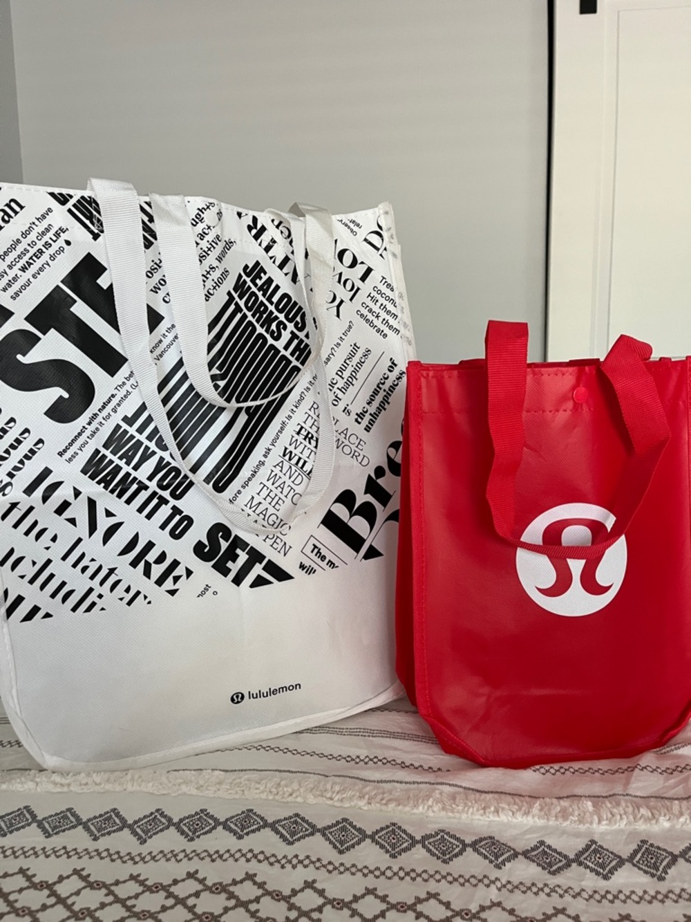 lululemon red and white graphic reusable tote pair